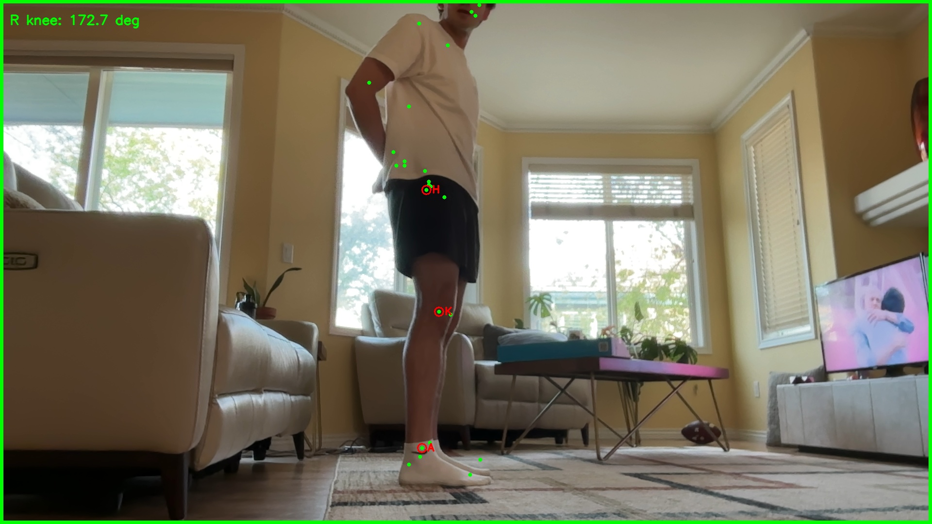The analyzer running live: pose landmarks overlaid on a runner, a real-time knee-angle readout, and a green border signalling the frame is trustworthy.